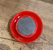 Arrangement of red magnetic buttons on a magnetic office board