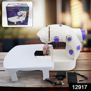Woman using the portable electric silai machine for home tailoring on a desktop.