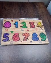 Detailed close-up of the smooth, child-safe wooden number puzzle pieces.