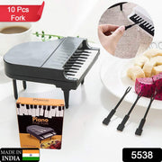 Colorful fruits arranged with the unique piano-shaped dessert picks for a vibrant presentation.
