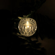 Close-up of crystal style LED decorative lamp showing diamond-cut design