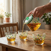 Glass tea pot and cups arranged beautifully for tea serving