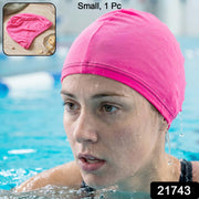 Pink silicone swim cap in vibrant pink color