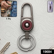 Close-up of metal key holder with sleek modern finish and secure locking carabiner