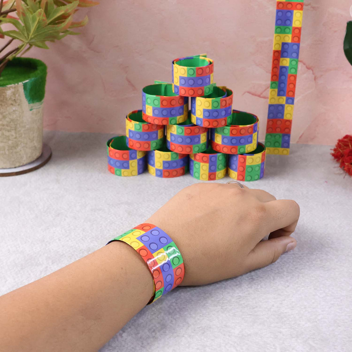 Various snap slap bracelets lined up with vibrant patterns