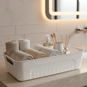 Side view of stackable white plastic storage baskets